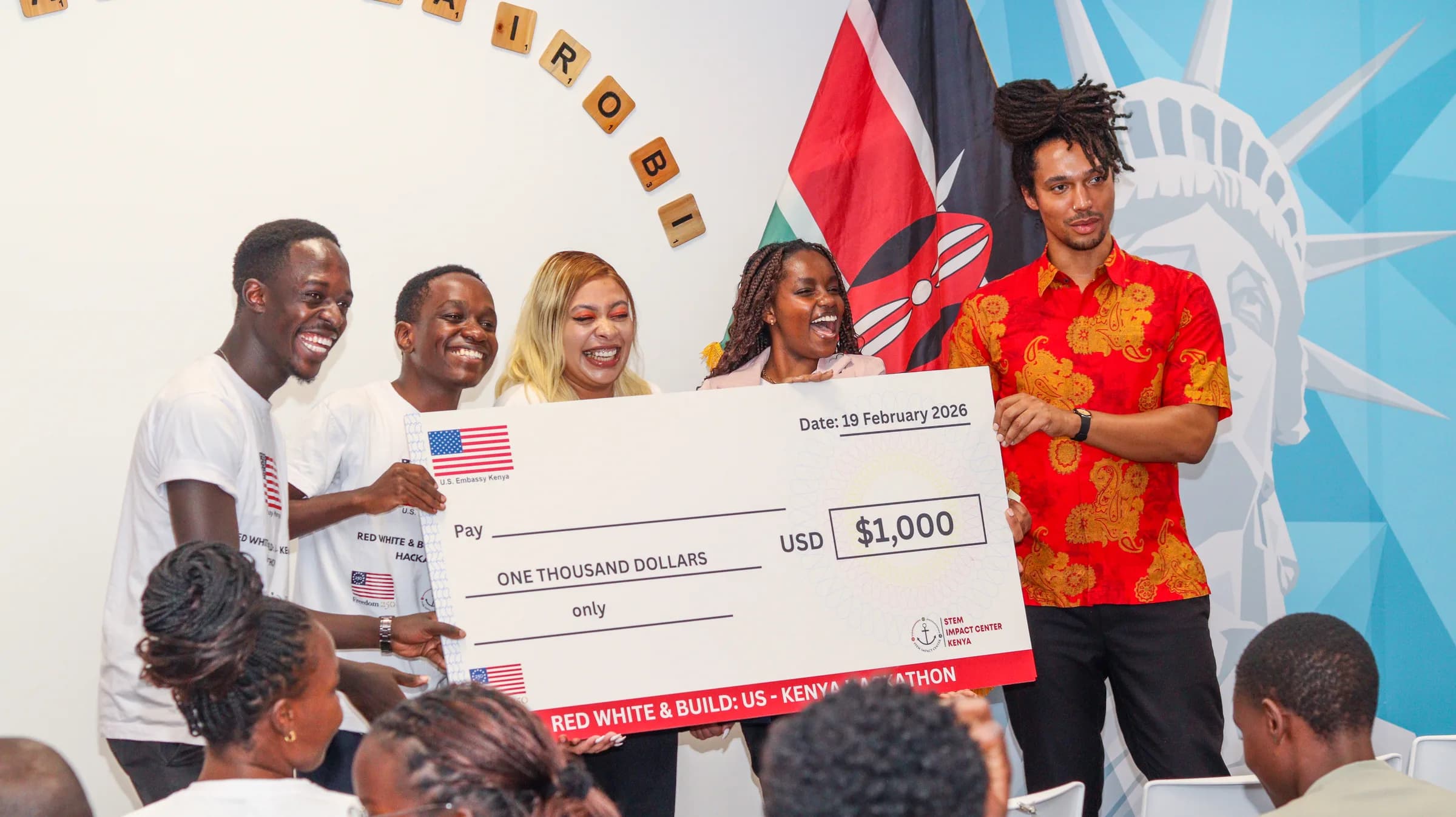 The winning team holding the $1,000 prize cheque